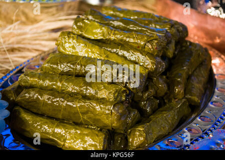 a silver plate of delicious stuffed grape leaves Stock Photo