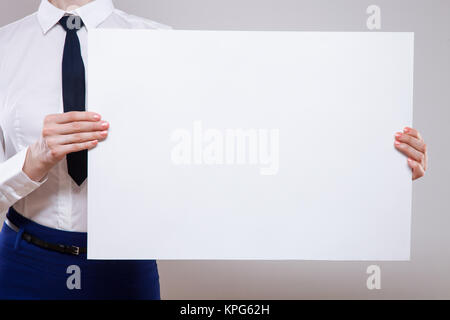 Unrecognizable businesswoman holding an empty placard Stock Photo