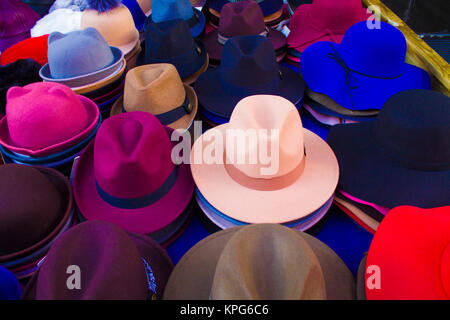 many different colors hats on the street bazaar Stock Photo