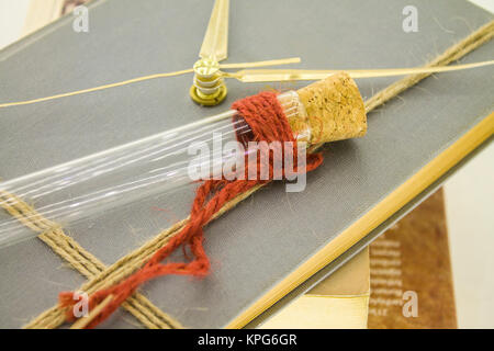 the note on the white floor is swollen, and old books; clock book Stock Photo