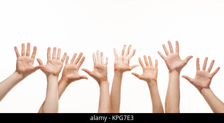 Many hands reaching out in the air Stock Photo