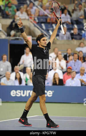 FLUSHING NY- SEPTEMBER 04: Roger Federer defeats Gael Monfils Day ten of the 2014 US Open at the USTA Billie Jean King National Tennis Center on September 3, 2014 in the Flushing neighborhood of the Queens borough of New York City   People:  Roger Federer Stock Photo