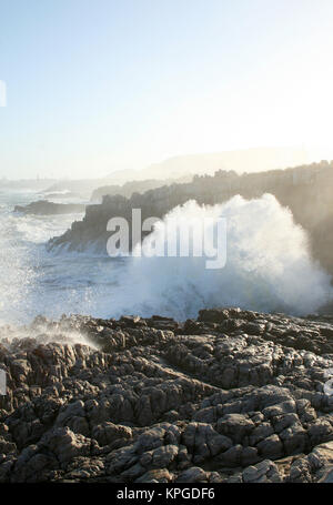 Wave breaking over rocks,  Splash Rock, Hermanus, South Africa Stock Photo