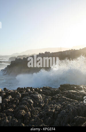 Wave breaking over rocks, Splash Rock, Hermanus, South Africa Stock Photo