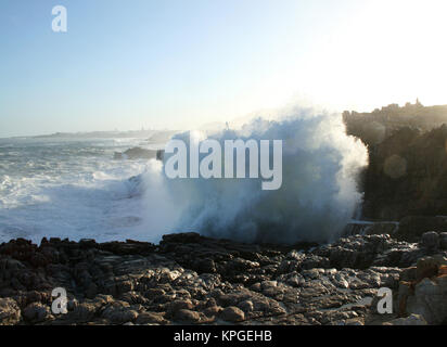 Wave breaking over rocks,  Splash Rock, Hermanus, South Africa Stock Photo
