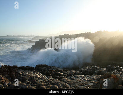 Wave breaking over rocks,  Splash Rock, Hermanus, South Africa Stock Photo