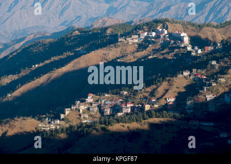 Apartment buildings and houses on side of mountain in Shimla, India Stock Photo