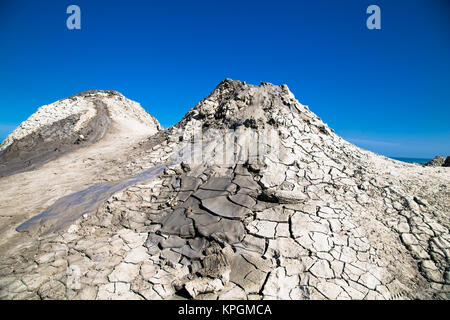 Field with craters of mud volcano in Gobustan and eruption mud. Azerbaijan. Stock Photo