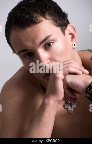 Model released , Junger Mann, 27, mit Gesichtspiercings - man with face piercings Stock Photo