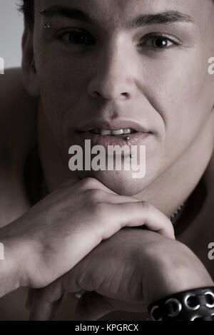 Model released , Junger Mann, 27, mit Gesichtspiercings - man with face piercings Stock Photo