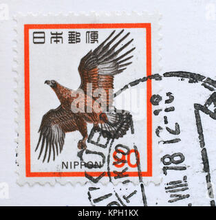 Nippon/Japanese postage stamp with Golden Eagle and ink stamp, South Africa. Stock Photo