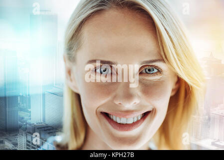 Young happy woman smiling and feeling good herself. Stock Photo