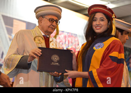 QUETTA, PAKISTAN. Dec-14 2017: Chancellor and Governor of Balochistan Mr. Muhammad Khan Achakzai awarding degree to pass out graduates during ceremony Stock Photo