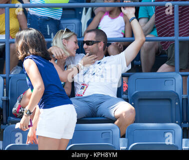 FLUSHING NY- AUGUST 27: Professional golfer from Spain Sergio Garcia with German girlfriend Katharina Boehm who was spotted wearing what appears to be a engagement ring on Arthur Ashe stadium On Day Three of the 2014 US Open at the USTA Billie Jean King National Tennis Center on August 27, 2014 in the Flushing neighborhood of the Queens borough of New York City.   People:  Sergio Garcia, Katharina Boehm Stock Photo