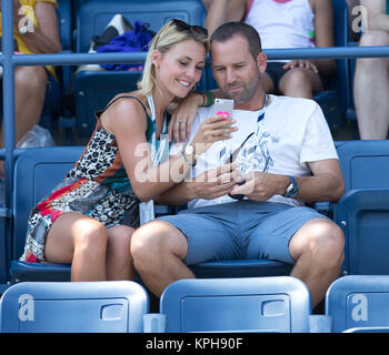 FLUSHING NY- AUGUST 27: Professional golfer from Spain Sergio Garcia with German girlfriend Katharina Boehm who was spotted wearing what appears to be a engagement ring on Arthur Ashe stadium On Day Three of the 2014 US Open at the USTA Billie Jean King National Tennis Center on August 27, 2014 in the Flushing neighborhood of the Queens borough of New York City.   People:  Sergio Garcia, Katharina Boehm Stock Photo