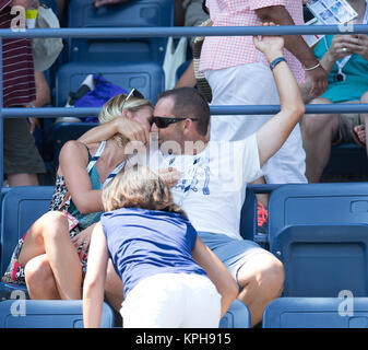 FLUSHING NY- AUGUST 27: Professional golfer from Spain Sergio Garcia with German girlfriend Katharina Boehm who was spotted wearing what appears to be a engagement ring on Arthur Ashe stadium On Day Three of the 2014 US Open at the USTA Billie Jean King National Tennis Center on August 27, 2014 in the Flushing neighborhood of the Queens borough of New York City.   People:  Sergio Garcia, Katharina Boehm Stock Photo