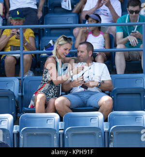 FLUSHING NY- AUGUST 27: Professional golfer from Spain Sergio Garcia with German girlfriend Katharina Boehm who was spotted wearing what appears to be a engagement ring on Arthur Ashe stadium On Day Three of the 2014 US Open at the USTA Billie Jean King National Tennis Center on August 27, 2014 in the Flushing neighborhood of the Queens borough of New York City.   People:  Sergio Garcia, Katharina Boehm Stock Photo