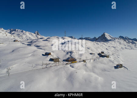 Train station on Bernina Pass, Bernina express. Winter Stock Photo