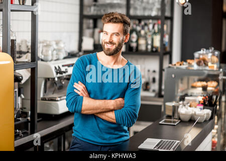 Portrait of a handsome cafe owner Stock Photo