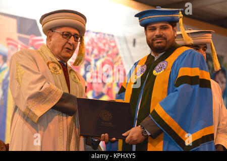 QUETTA, PAKISTAN. Dec-14 2017: Chancellor and Governor of Balochistan Mr. Muhammad Khan Achakzai awarding doctorate degree to PHD holders during cerem Stock Photo