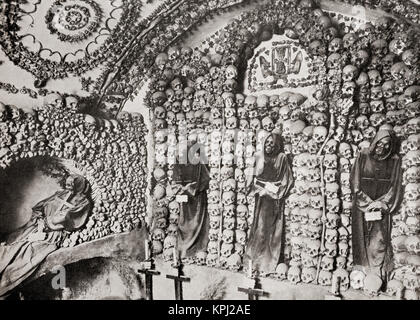 The Capuchin Crypt, a small space comprising several tiny chapels located beneath the church of Santa Maria della Concezione dei Cappuccini on the Via Veneto, Rome, Italy, lined with the skeletal remains of 3,700 bodies believed to be Capuchin friars.  From The Wonders of the World, published c.1920. Stock Photo