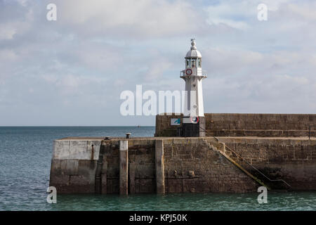 The Mevagissey lighthouse on the south breakwater is 8 metres high and was constructed in 1896. Stock Photo