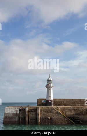 The Mevagissey lighthouse on the south breakwater is 8 metres high and was constructed in 1896. Stock Photo