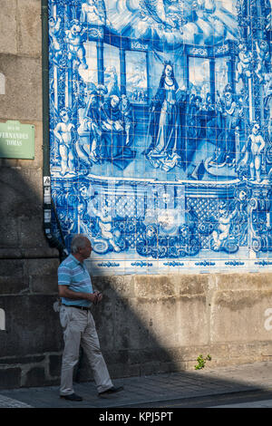 Traditional, blue glazed, dececorated tiles, azulejos,on the exterior of Capela das Almas church, in the centre of Porto, Portugal Stock Photo
