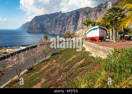 colourful painted fishing boat near the ocean in los gigantes,tenerife,canary islands,a picture postcard scenic view of the island. Stock Photo