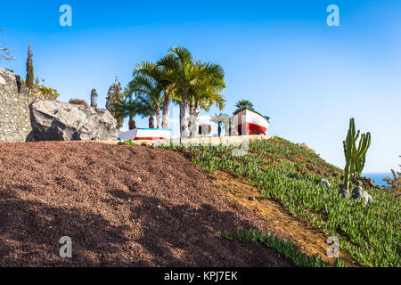 colourful painted fishing boat near the ocean in los gigantes,tenerife,canary islands,a picture postcard scenic view of the island. Stock Photo