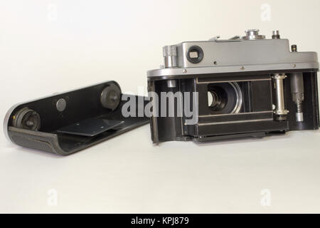 partially disassembled a vintage camera with opened shutter curtain; prepared for loading with photo film Stock Photo