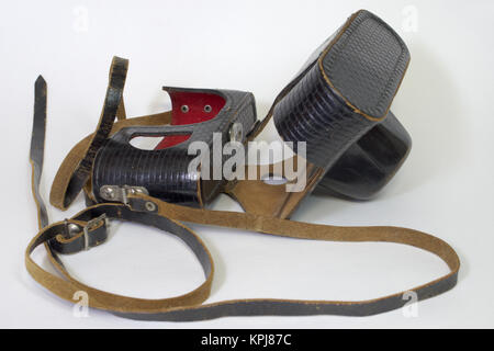 Solid leather case for vintage camera. On the strap and with red lining inside Stock Photo