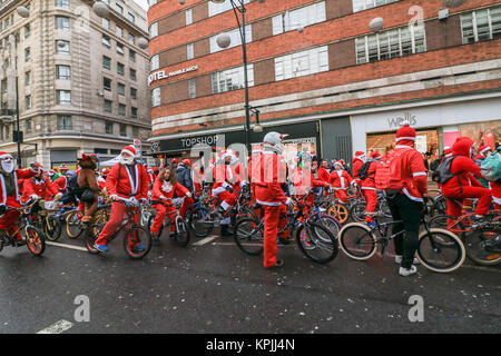 London, UK. 16th Dec, 2017.Oxford Street, London.  Hundred Santa's take part in the BMXLife’s London Santa Cruise on Oxford Street to raise money for children with heart conditions at Evelina London Children’s Hospital (ECHO). BMX Life  is an annual event which began three years ago after Stephane Wright’s son Tommy who was only 6 months old, suffered a heart attack and  was admitted to Evelina London Children’s Hospital in October 2014. Credit: amer ghazzal/Alamy Live News Stock Photo