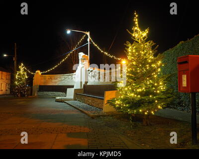 Eastchurch, Kent, UK. 16th Dec, 2017. The Christmas lights on display in the small village of Eastchurch (population 3000) on the Isle of Sheppey in Kent. The aviation memorial lit up. Eastchurch is styled the 'home of British aviation' as Eastchurch airfield saw the first controlled flight by a British pilot on British soil. Credit: James Bell/Alamy Live News Stock Photo