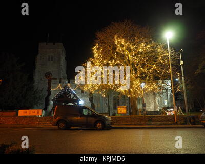 Eastchurch, Kent, UK. 16th Dec, 2017. The Christmas lights on display in the small village of Eastchurch (population 3000) on the Isle of Sheppey in Kent. All Saints Church brightly lit up and exhibiting a traditional nativity scene. Eastchurch is styled the 'home of British aviation' as Eastchurch airfield saw the first controlled flight by a British pilot on British soil. Credit: James Bell/Alamy Live News Stock Photo