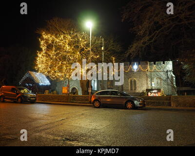 Eastchurch, Kent, UK. 16th Dec, 2017. The Christmas lights on display in the small village of Eastchurch (population 3000) on the Isle of Sheppey in Kent. All Saints Church brightly lit up and exhibiting a traditional nativity scene. Eastchurch is styled the 'home of British aviation' as Eastchurch airfield saw the first controlled flight by a British pilot on British soil. Credit: James Bell/Alamy Live News Stock Photo