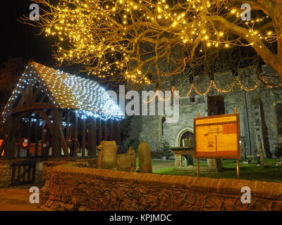 Eastchurch, Kent, UK. 16th Dec, 2017. The Christmas lights on display in the small village of Eastchurch (population 3000) on the Isle of Sheppey in Kent. All Saints Church brightly lit up and exhibiting a traditional nativity scene. Eastchurch is styled the 'home of British aviation' as Eastchurch airfield saw the first controlled flight by a British pilot on British soil. Credit: James Bell/Alamy Live News Stock Photo