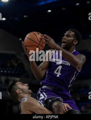 Saturday Dec 16th - Northwestern Wildcats forward Vic Law (4) is fouled on a drive to the basket during NCAA Mens basketball game action between the Northwestern Wildcats and the DePaul Blue Demons at the Windtrust Arena in Chicago, IL.