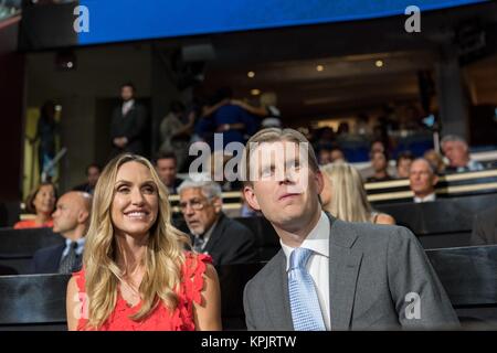 Eric Trump, son of GOP presidential nominee Donald Trump and his wife Lara Yunaska attend the second day of the Republican National Convention via live video link July 19, 2016 in Cleveland, Ohio. Earlier in the day the delegates formally nominated Donald J. Trump for president.