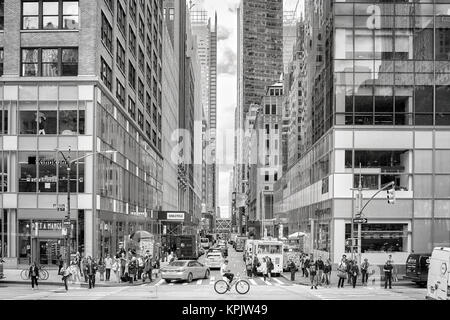 New York City, USA - May 26, 2017: Crowded pedestrian crossing at 6th Avenue during the afternoon rush hour. Stock Photo