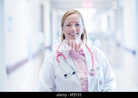 Mature nurse smiling, portrait. Stock Photo