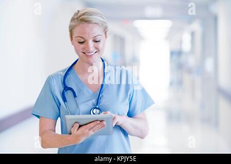 Female doctor using tablet. Stock Photo