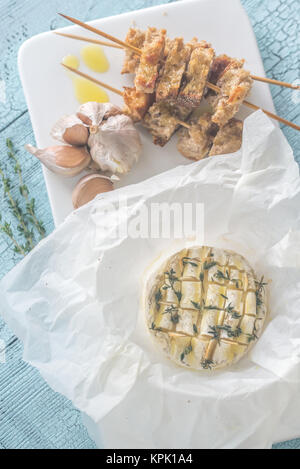 Camembert cheese fondue with toasted bread Stock Photo