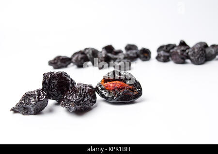 Dried plum fruits on white background isolated Stock Photo