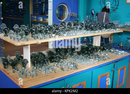 Display stand of all sorts of handmade Figures from recycled glass for sale, Kingdom of Swaziland. Stock Photo