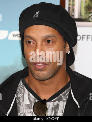 Brazilian footballer Ronaldinho poses for a photocall with artist Lincoln Townley who created a portrait of the sports star to be auctioned at the inaugural Football for Peace Ball on Friday 17th November  Featuring: Ronaldinho Where: London, United Kingdom When: 14 Nov 2017 Credit: WENN.com Stock Photo