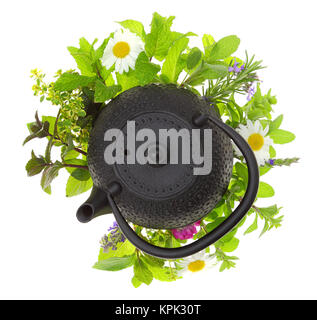 Teapot with bouquet of various herbs isolated on white Stock Photo