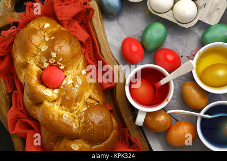 Easter sweet brioche, colored eggs and liquid dye Stock Photo