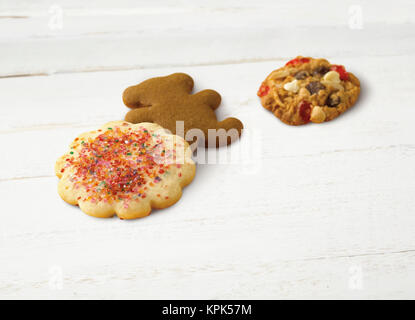 Variety of holiday cookies on a wooden white surface Stock Photo