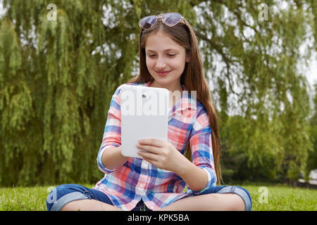 preteen girl sitting cross-legged on the floor Stock Photo - Alamy